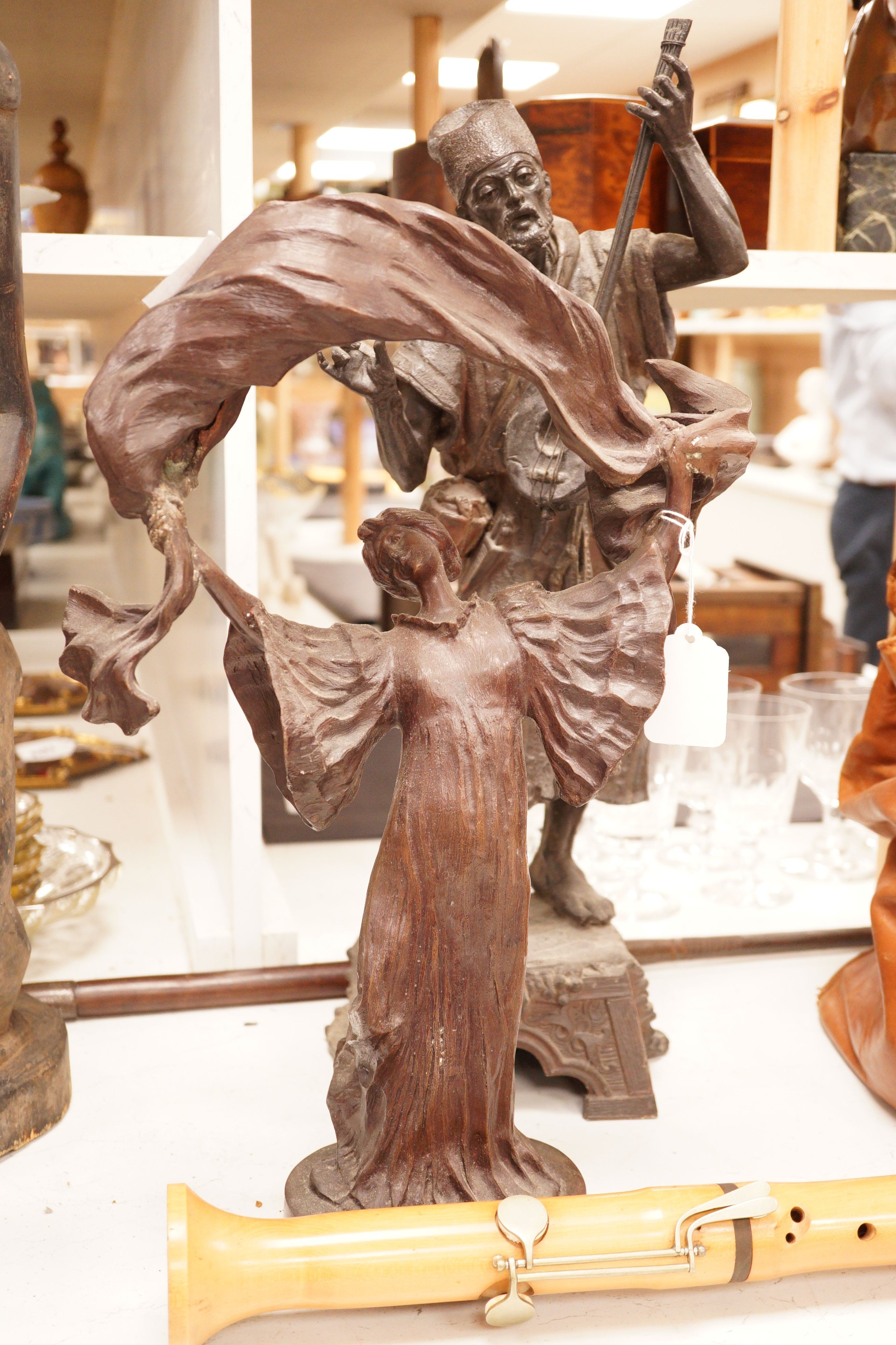 A large spelter figure of an eastern musician together with a bronze of a lady, tallest 58cm